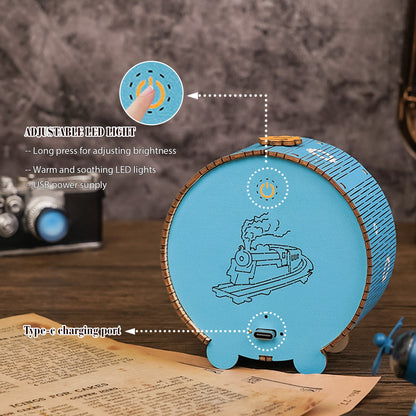 3D wooden steam train night light showing adjustable LED features and USB charging port.