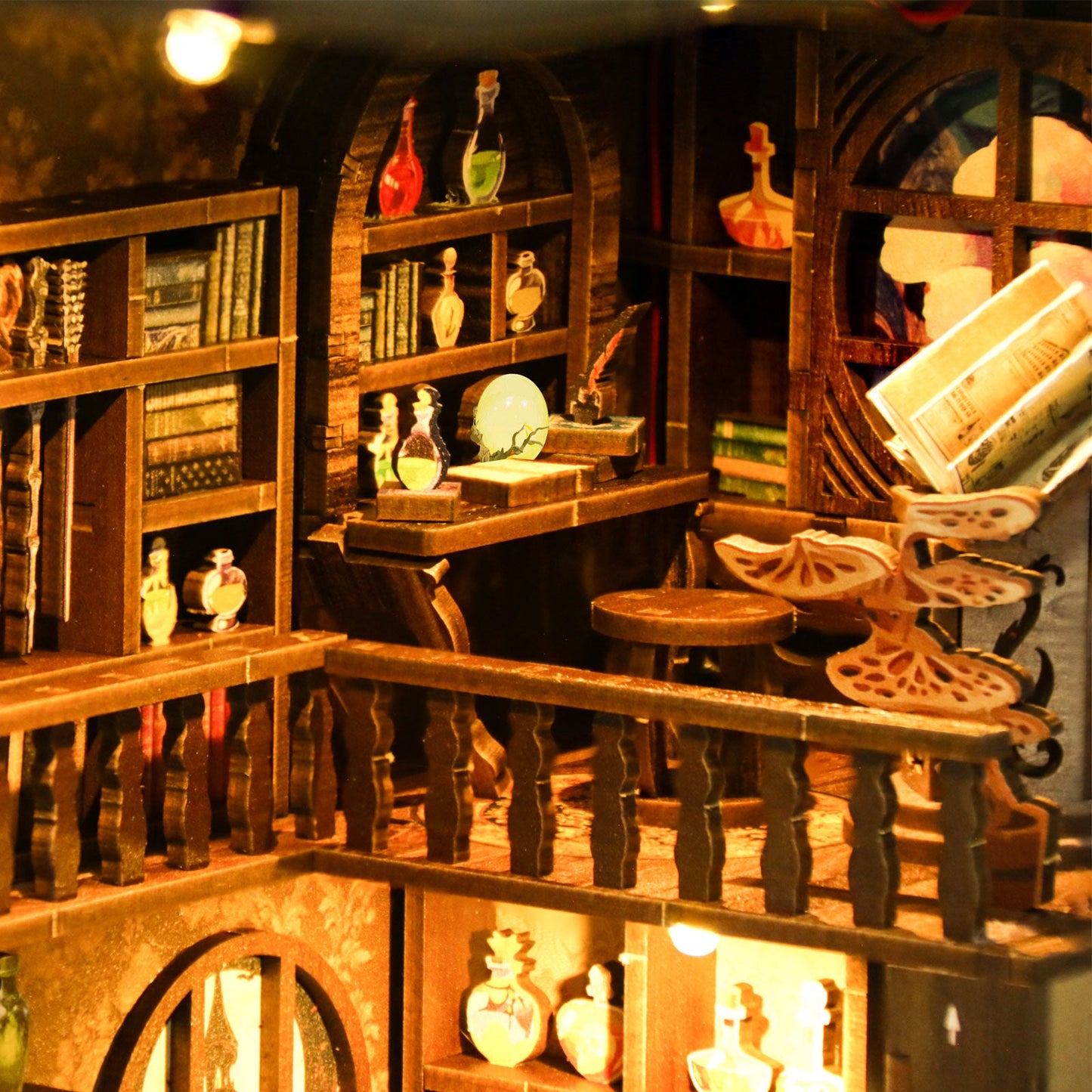 Interior view of the Magic Night DIY Book Nook Kit featuring detailed wooden shelves, potions, and whimsical furniture.