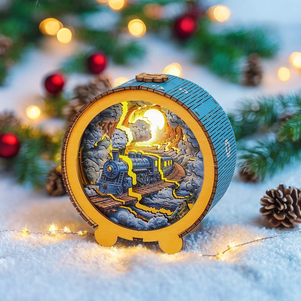 Steam train kit 3D wooden puzzle night light in a glowing circular design among holiday decorations.